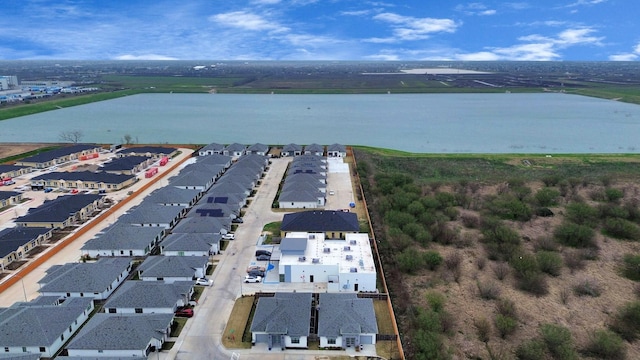 birds eye view of property with a residential view and a water view