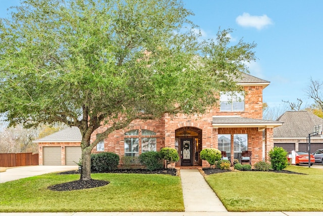 view of front facade featuring an attached garage, brick siding, fence, concrete driveway, and a front lawn