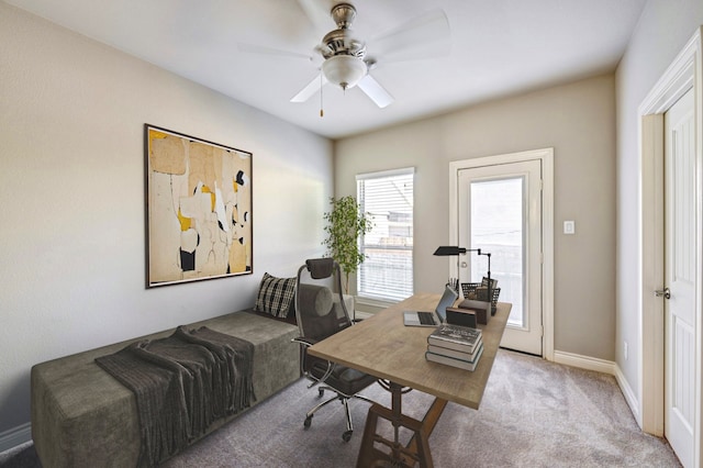 office with light carpet, ceiling fan, and baseboards