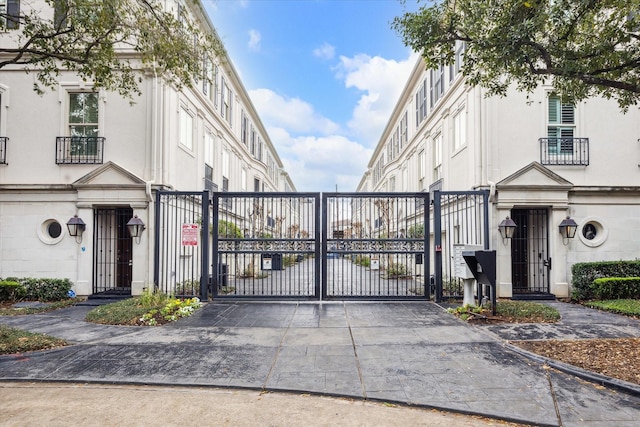 view of gate featuring fence