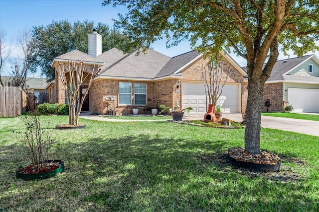 view of front of house with an attached garage, a chimney, a front lawn, and brick siding