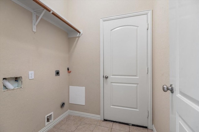 washroom with baseboards, laundry area, hookup for a washing machine, and hookup for an electric dryer