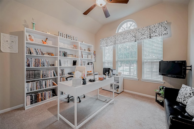 carpeted home office featuring lofted ceiling, ceiling fan, and baseboards