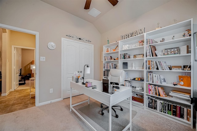 office area featuring baseboards, visible vents, a ceiling fan, light colored carpet, and lofted ceiling