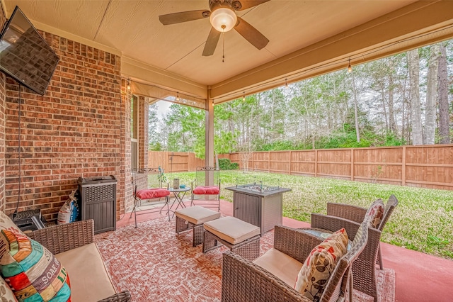 view of patio with a fenced backyard, outdoor lounge area, and a ceiling fan