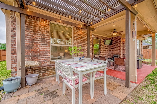 view of patio / terrace featuring outdoor dining area, fence, a ceiling fan, and a pergola