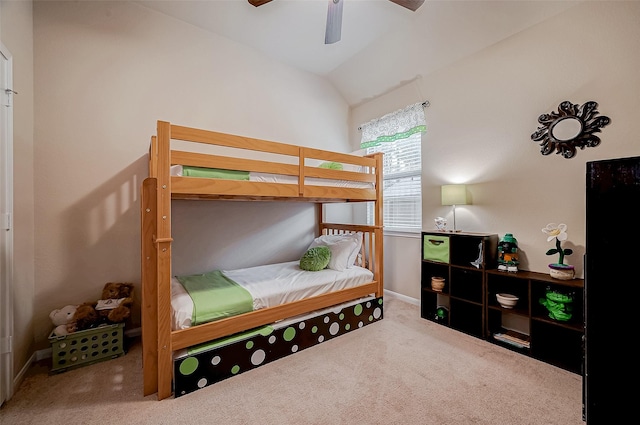 carpeted bedroom featuring baseboards, vaulted ceiling, and a ceiling fan