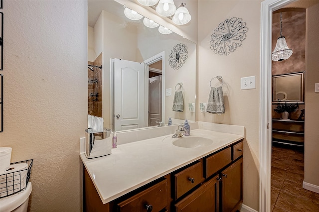 full bath with toilet, walk in shower, vanity, and tile patterned floors