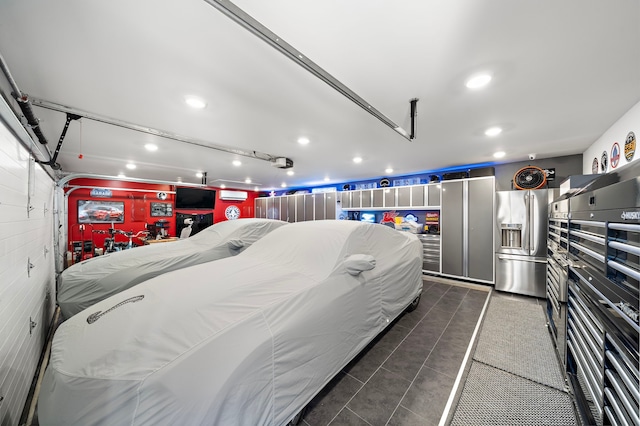 garage featuring recessed lighting and high quality fridge