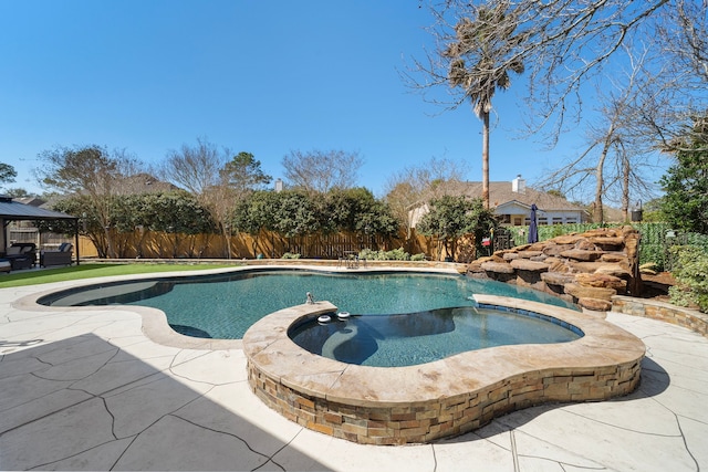 view of swimming pool with a fenced in pool, a gazebo, a patio area, an in ground hot tub, and fence private yard