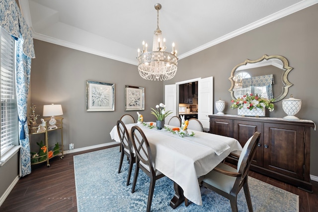 dining space with ornamental molding, dark wood-style flooring, a notable chandelier, and baseboards