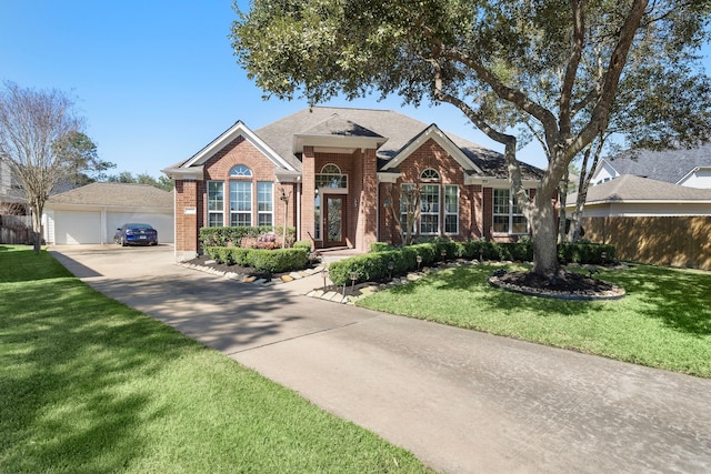 view of front of property with a garage, a front lawn, and brick siding