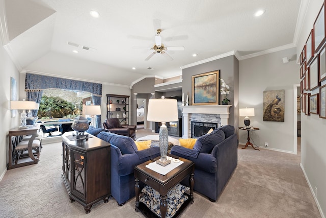 living room featuring a fireplace, ornamental molding, vaulted ceiling, and light colored carpet