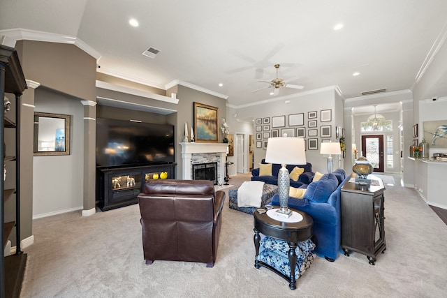 living room with a stone fireplace, light carpet, visible vents, baseboards, and ornamental molding