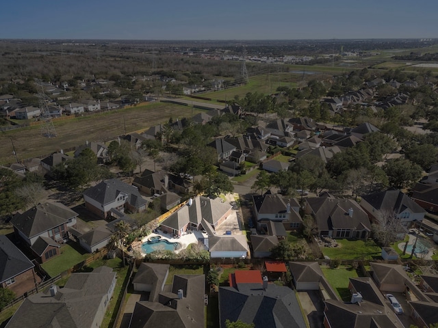 birds eye view of property with a residential view