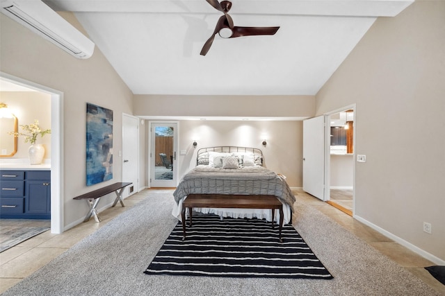 bedroom featuring access to exterior, lofted ceiling, an AC wall unit, and ensuite bathroom