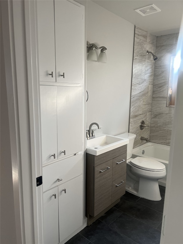 full bath with toilet, vanity, visible vents, shower / bathing tub combination, and tile patterned floors