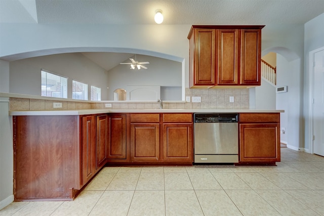 kitchen with tasteful backsplash, light countertops, dishwasher, and ceiling fan