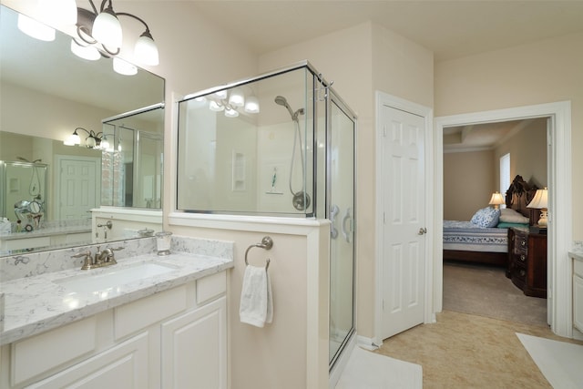 ensuite bathroom with ensuite bath, an inviting chandelier, a stall shower, and vanity