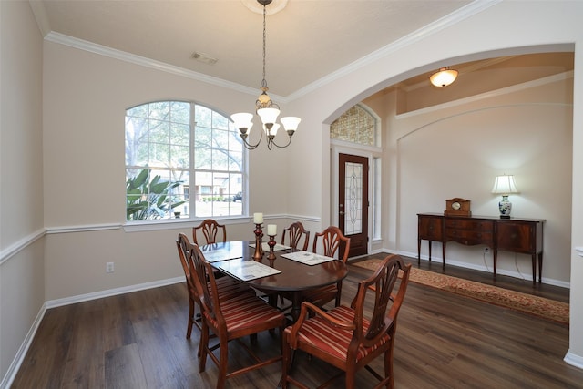 dining space with a chandelier, visible vents, baseboards, and wood finished floors