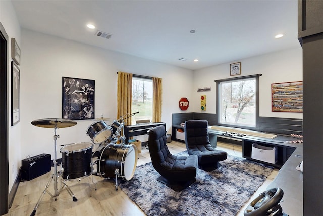 home office featuring light wood-style floors, recessed lighting, and visible vents