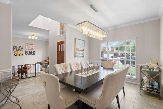 dining room featuring ornamental molding and a notable chandelier