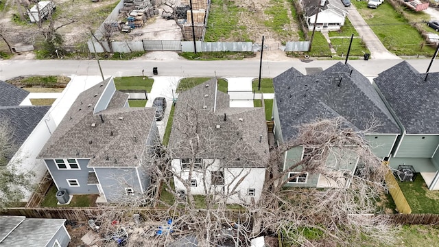 birds eye view of property with a residential view