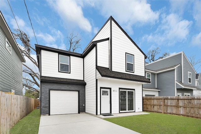 view of front of home with a garage, concrete driveway, fence, and a front lawn