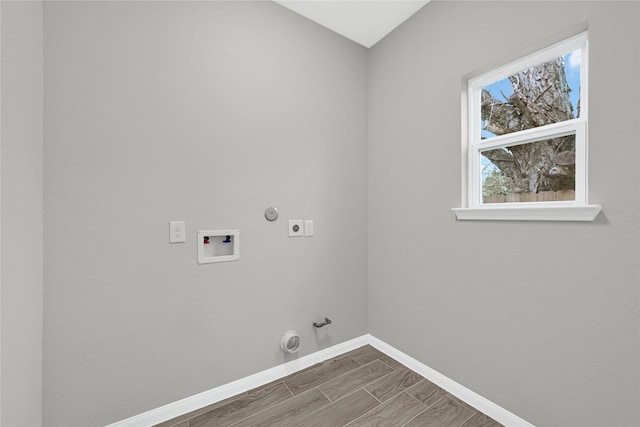 laundry area featuring hookup for a washing machine, hookup for a gas dryer, laundry area, baseboards, and electric dryer hookup