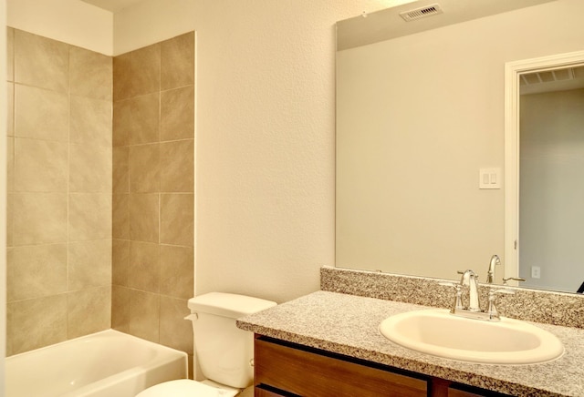 full bath with toilet,  shower combination, vanity, and visible vents