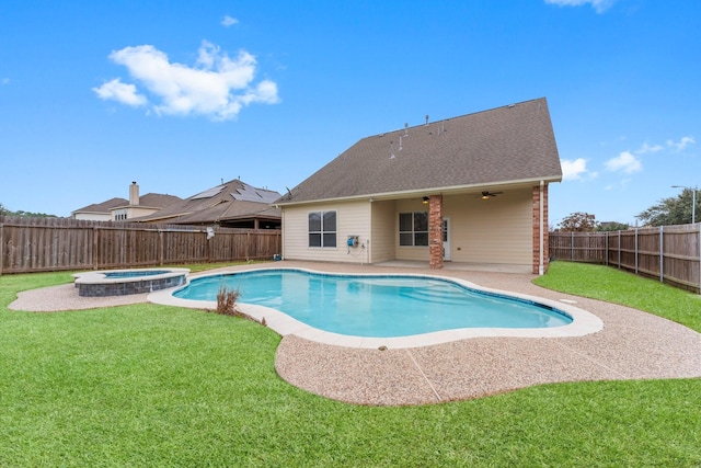 view of pool with a fenced backyard, a yard, a patio, and a ceiling fan