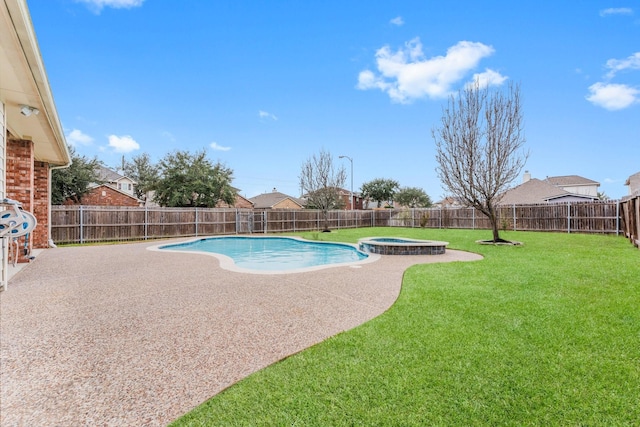 view of swimming pool featuring a pool with connected hot tub, a fenced backyard, a patio, and a lawn