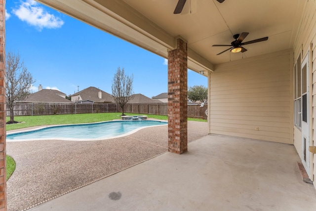 view of pool with a fenced backyard, a lawn, ceiling fan, and a patio area