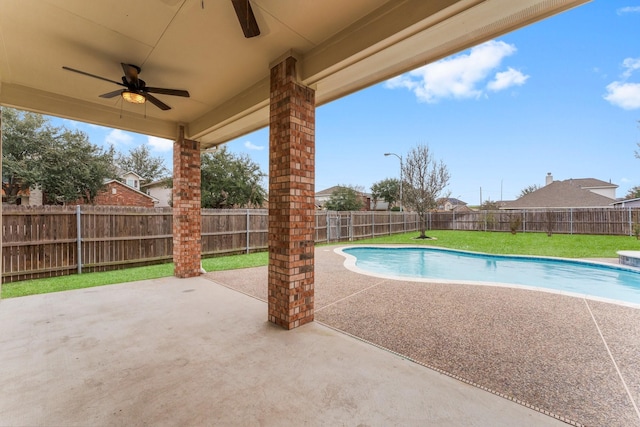 view of pool featuring a patio, a fenced in pool, a fenced backyard, and a ceiling fan