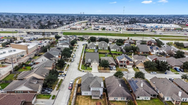 birds eye view of property with a residential view