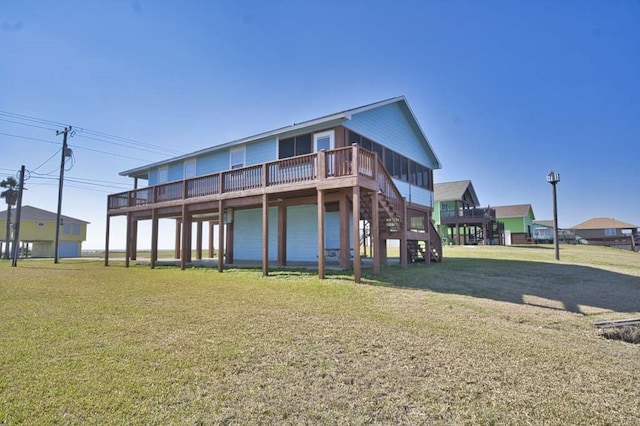 back of property featuring a lawn and a wooden deck