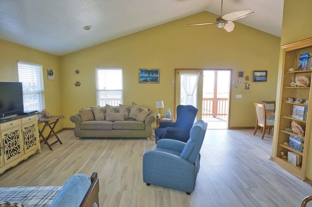 living area with light wood-style floors and a healthy amount of sunlight