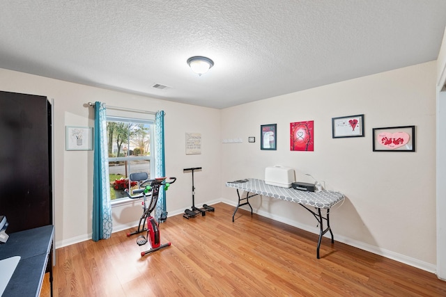 1009 Canadian St, Houston, TX 77009 - office space with light wood-style flooring, a textured ceiling, baseboards, and visible vents