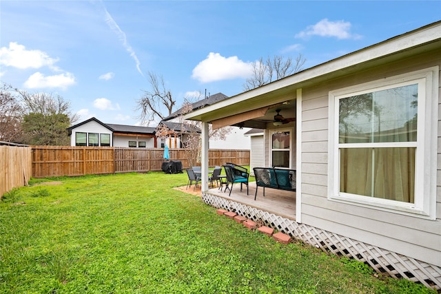 1009 Canadian St, Houston, TX 77009 - view of yard featuring a fenced backyard, a deck, and ceiling fan