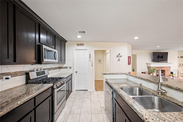 1009 Canadian St, Houston, TX 77009 - kitchen with visible vents, stainless steel appliances, recessed lighting, a sink, and backsplash