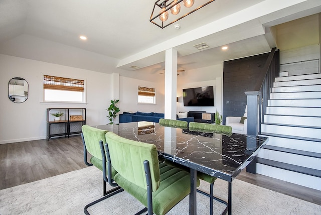 dining room with baseboards, visible vents, wood finished floors, stairs, and recessed lighting