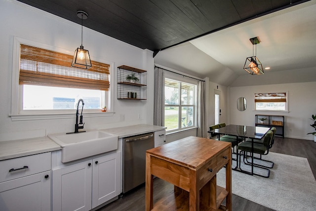 kitchen with pendant lighting, open shelves, stainless steel dishwasher, white cabinetry, and a sink