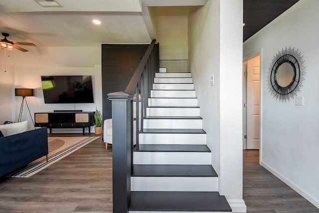 stairs featuring ceiling fan, recessed lighting, wood finished floors, visible vents, and baseboards