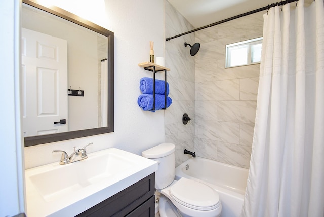 full bath featuring shower / bath combo, vanity, and toilet