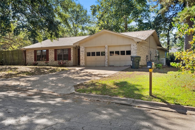 ranch-style house featuring an attached garage, concrete driveway, board and batten siding, and brick siding