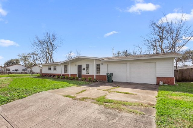 ranch-style home featuring brick siding, concrete driveway, a front yard, fence, and a garage