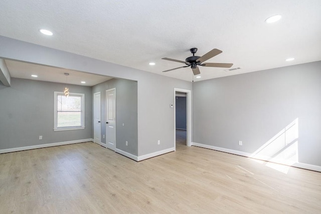 spare room featuring visible vents, baseboards, light wood-style flooring, ceiling fan, and recessed lighting