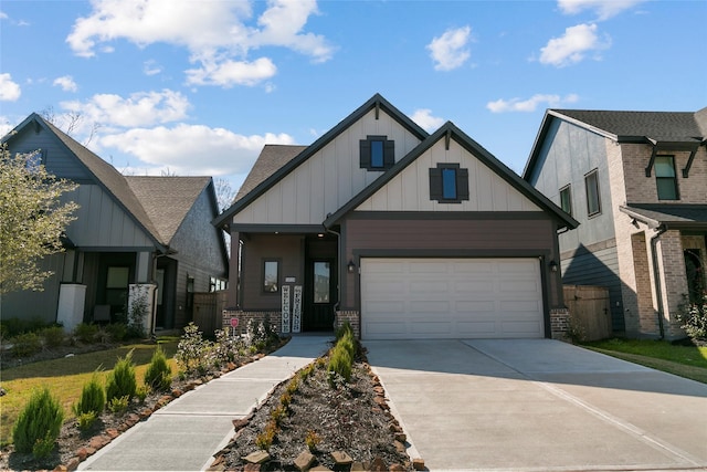 view of front of house with a garage, board and batten siding, and concrete driveway