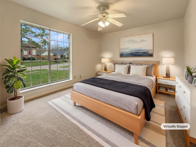 bedroom with carpet and a ceiling fan