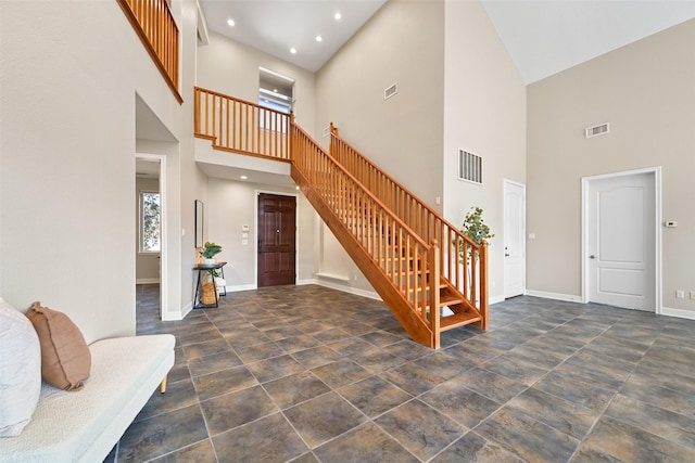 foyer featuring visible vents, recessed lighting, stairs, and baseboards